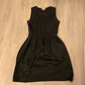 Black laser cut scuba fabric black dress. A line. Super cute!
